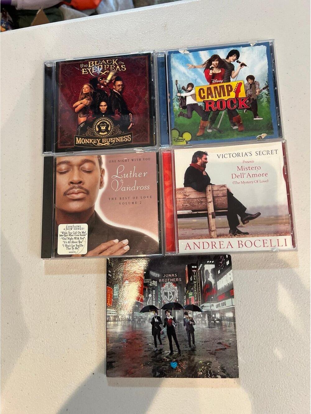Lot of CDs, black eyed peas, camp rock, luther, andrea, jonas brothers